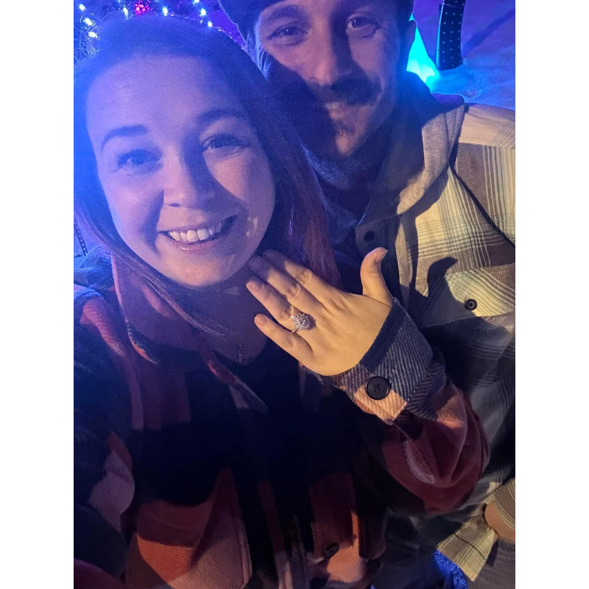 December 31st 2023 Zach proposed. We always go to Madison to see the Christmas lights. Zach coordinated to have the lights at one of the houses say "Marry me Tara". Of course I said "YES!"