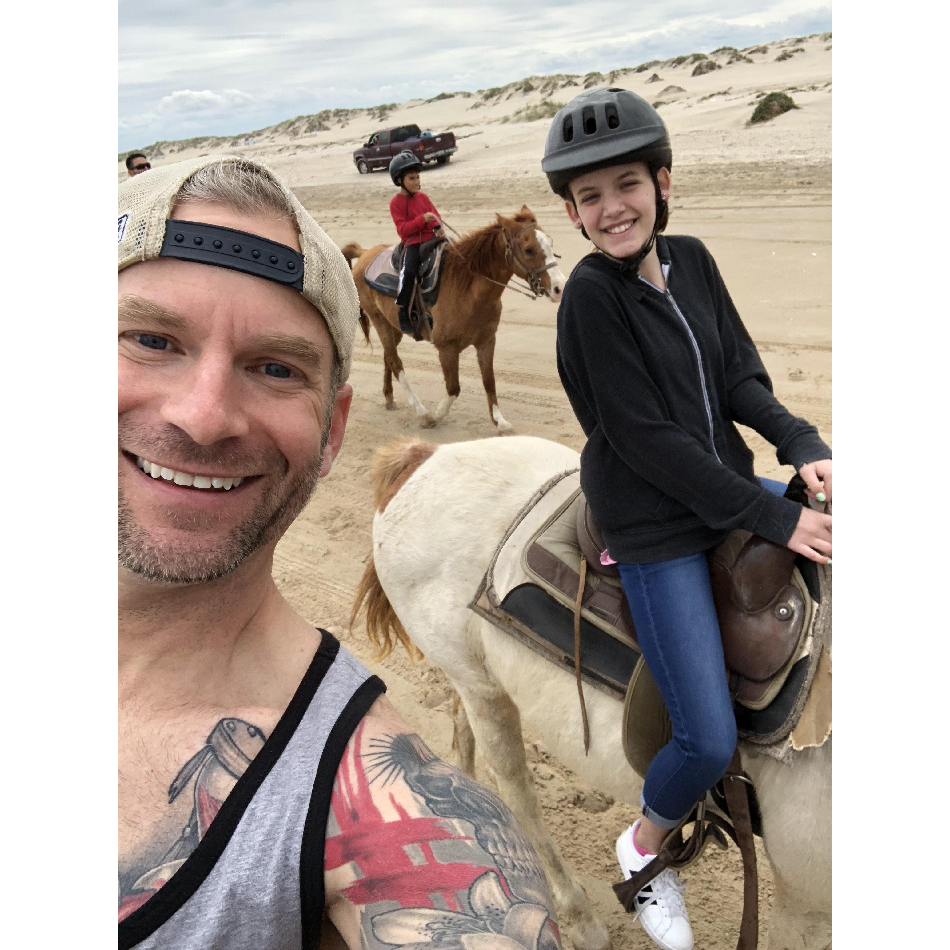 London and Anthony horseback riding on South Padre Beach