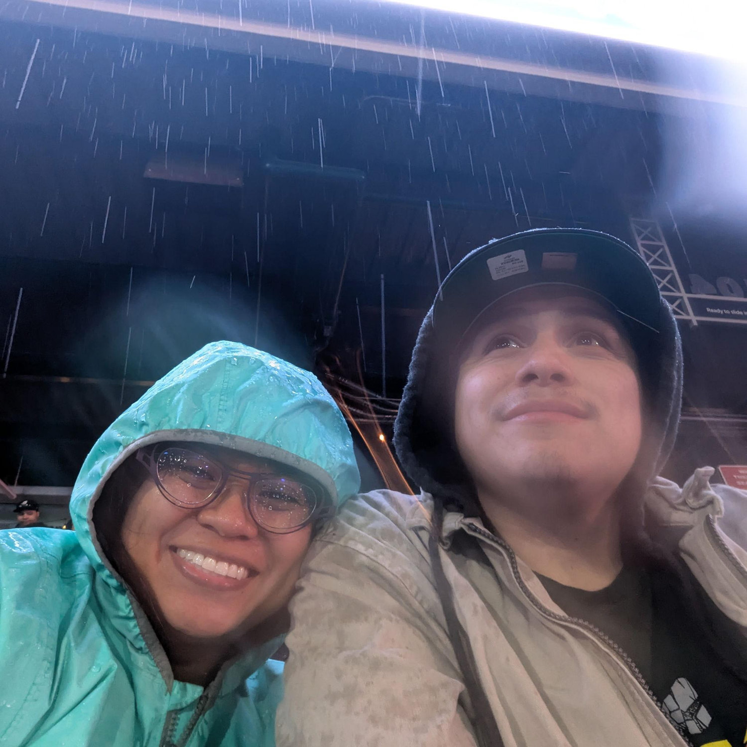 Rain or shine, we stick together (rainy baseball game in Reno!)
