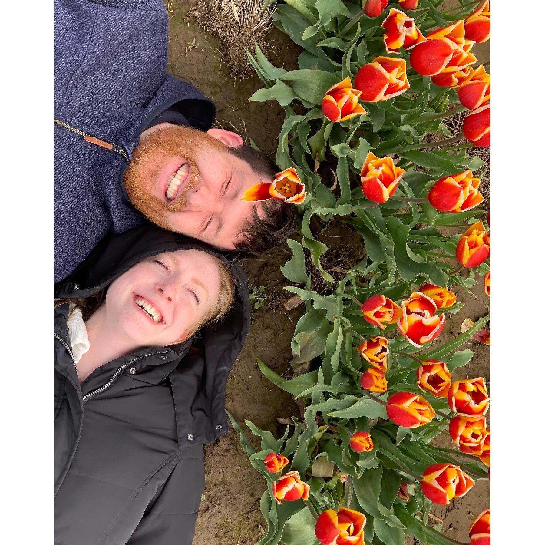 Giggling by some tulips