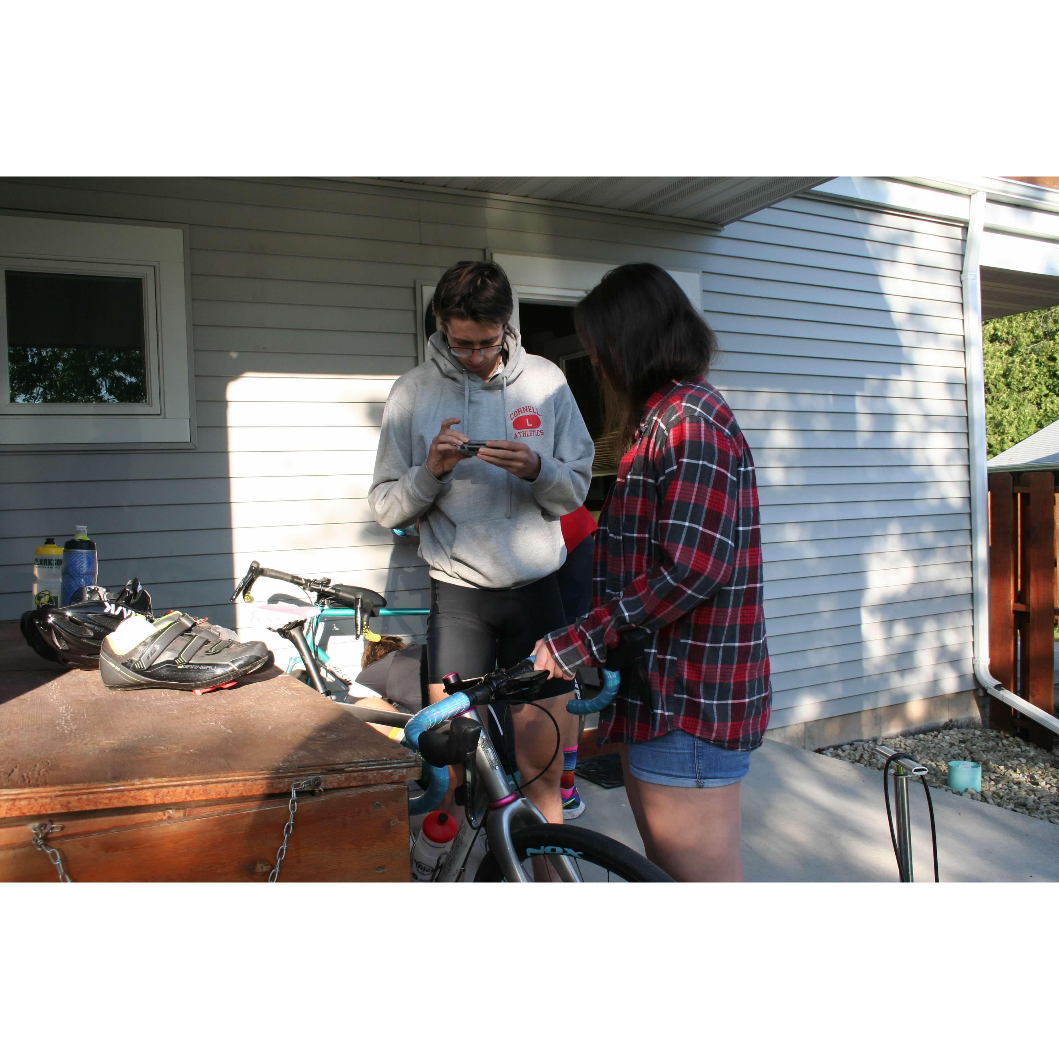 Gideon bikes, and Mackenzie pretends to help