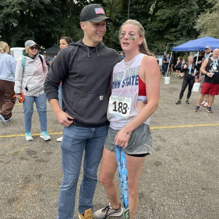 Bryan meeting Kaitlyn at the finish line of the Beast on the Bay while Kaitlyn was fighting for her life