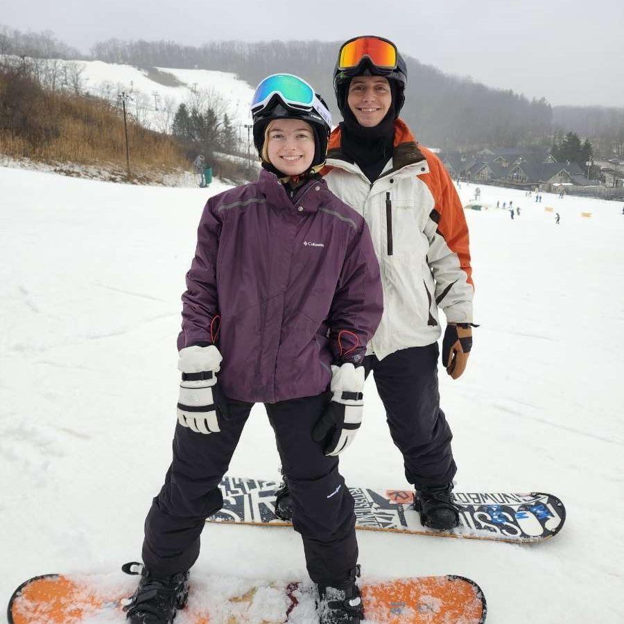 Sydney's first time snowboarding - still smiling after many falls