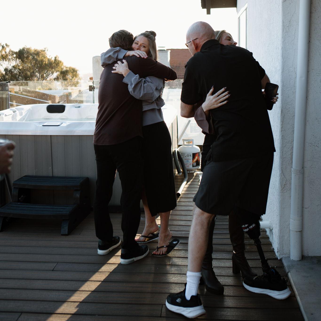 hugging the grooms parents<3