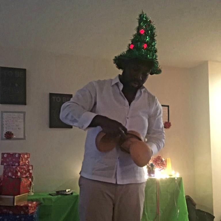 My cutie at Christmas telling the family about calabash. With this fun hat from mami.