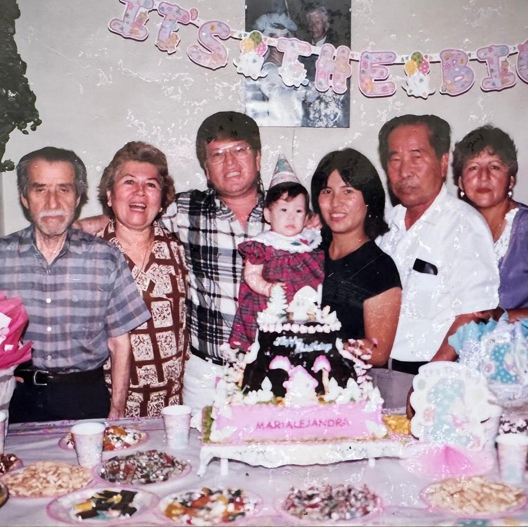 Mary's 1st birthday. Picture with her grandparents from both her parents' sides. (Left to Right: Luis Armando, Luz, Marcial, Mary, Mariela, Ulises, Isolina). Moyobamba, Peru. January 1997.