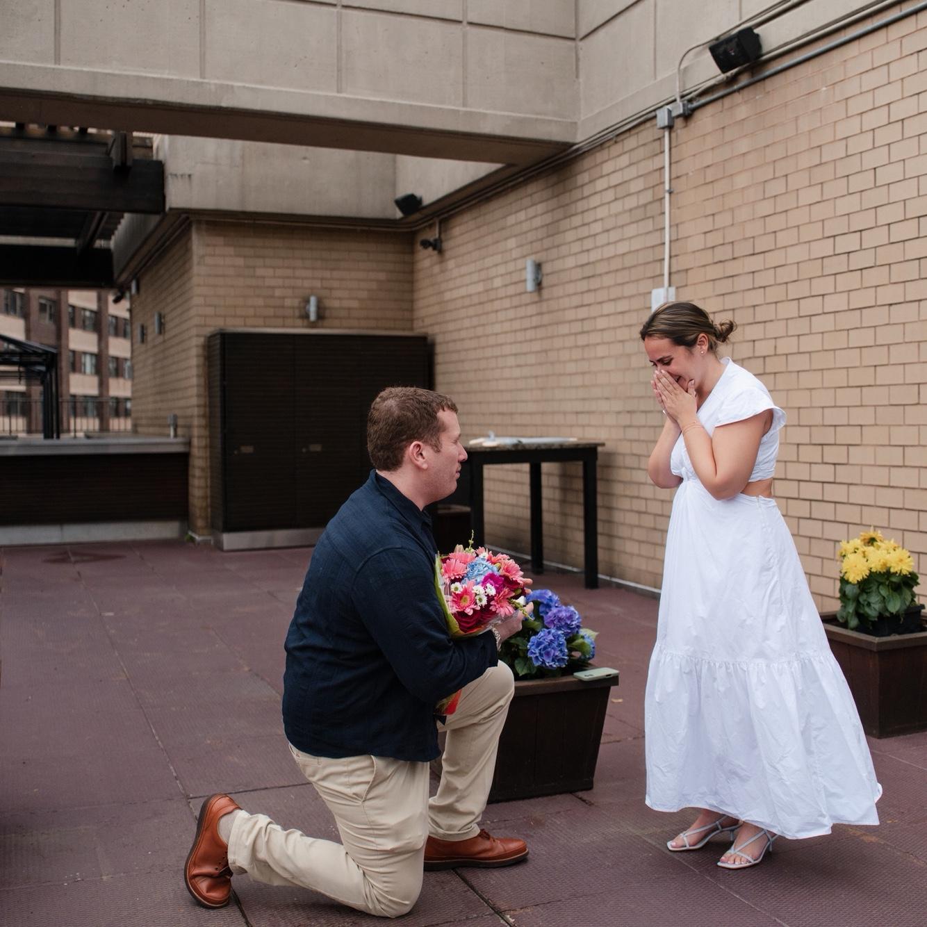 She said yes! Right on the roof of our building!