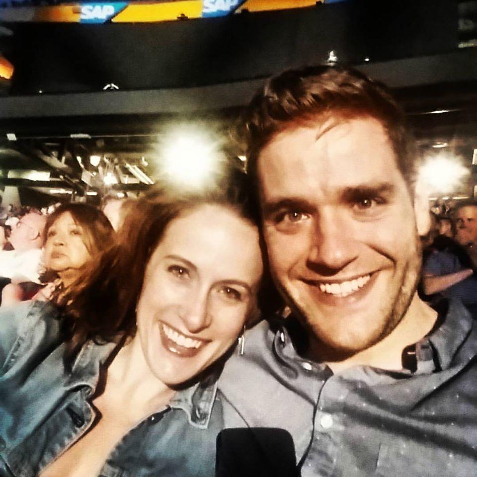 At a U2 concert. Alice had never seen them live. She needed earplugs.
