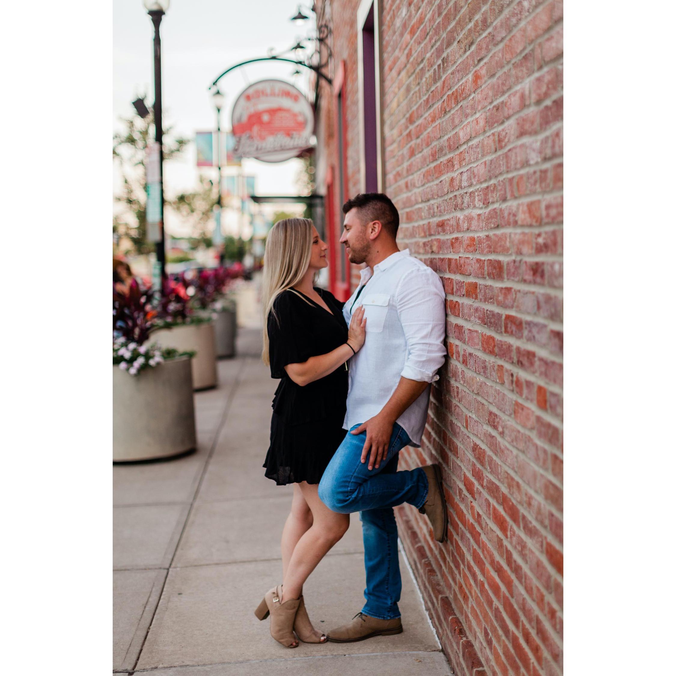 Engagement Photo in front of Tom's favorite pizza place in downtown Valpo