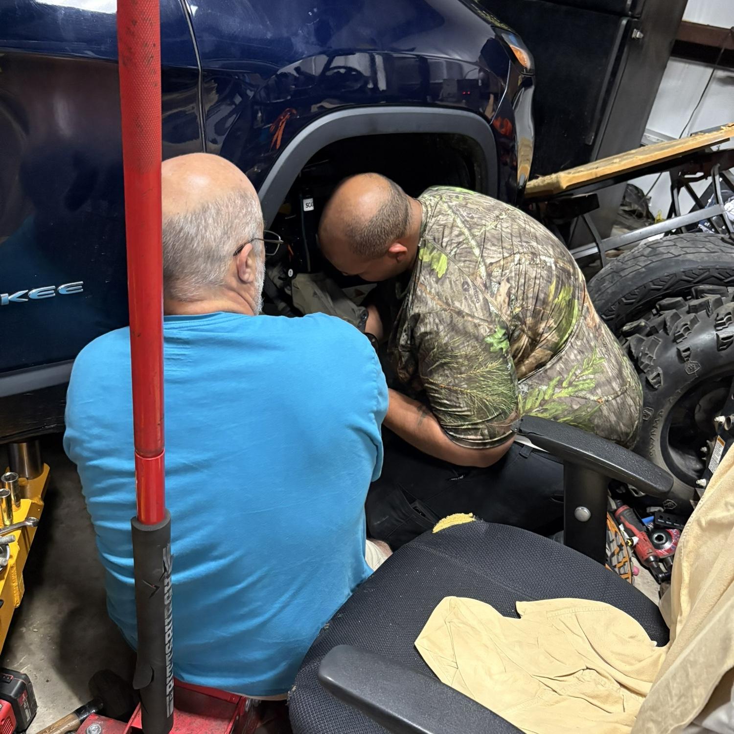 Helping my dad with the cars