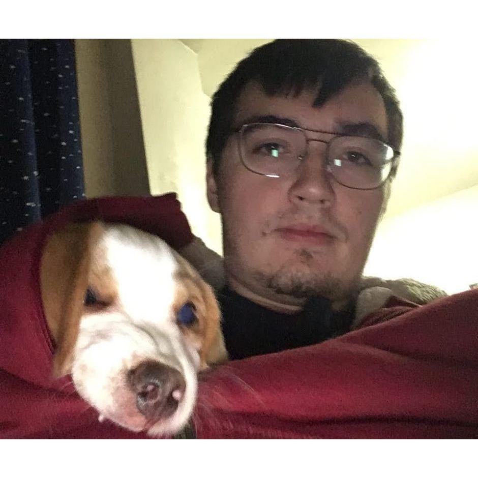 Bagel teething on John's favorite sweater