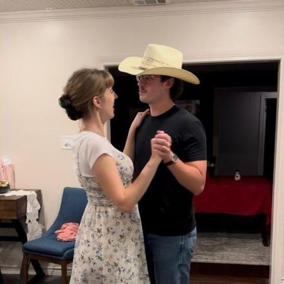 John-Luc and Grace learning the Texas Two Step during their first dance lesson. The cowboy hat helped him get into character.