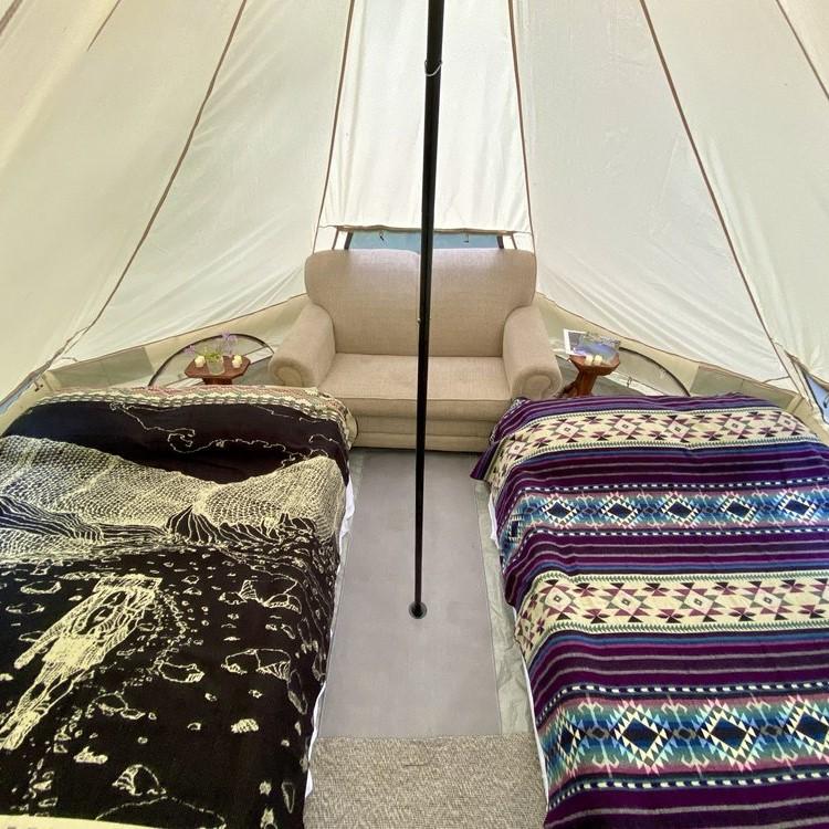 Tents have battery powered lanterns but be sure to bring a charger pack for cell phones - or plan to charge them in the main lodge.