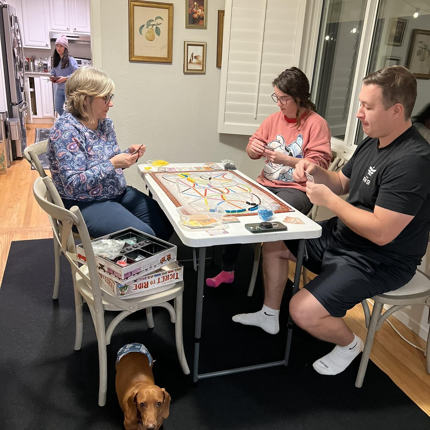Enjoying a now traditional Reilly Family gathering game, Ticket to Ride, with Jenelle's mom!