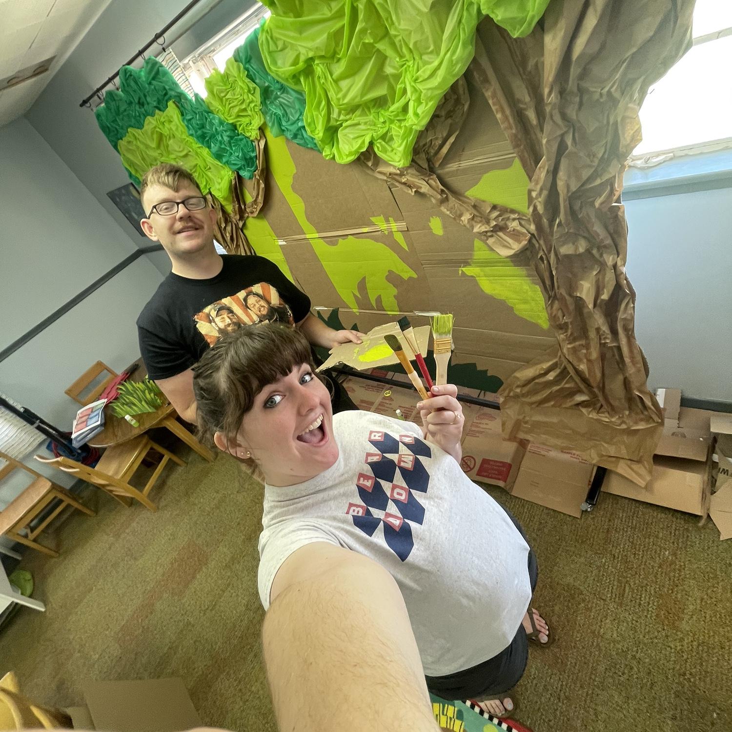 The day after our engagement, Raegan needed to finish decorating for our church's Vacation Bible School. So the loving and selfless man Hunter is, he joined alongside to paint the backdrop for hours.
