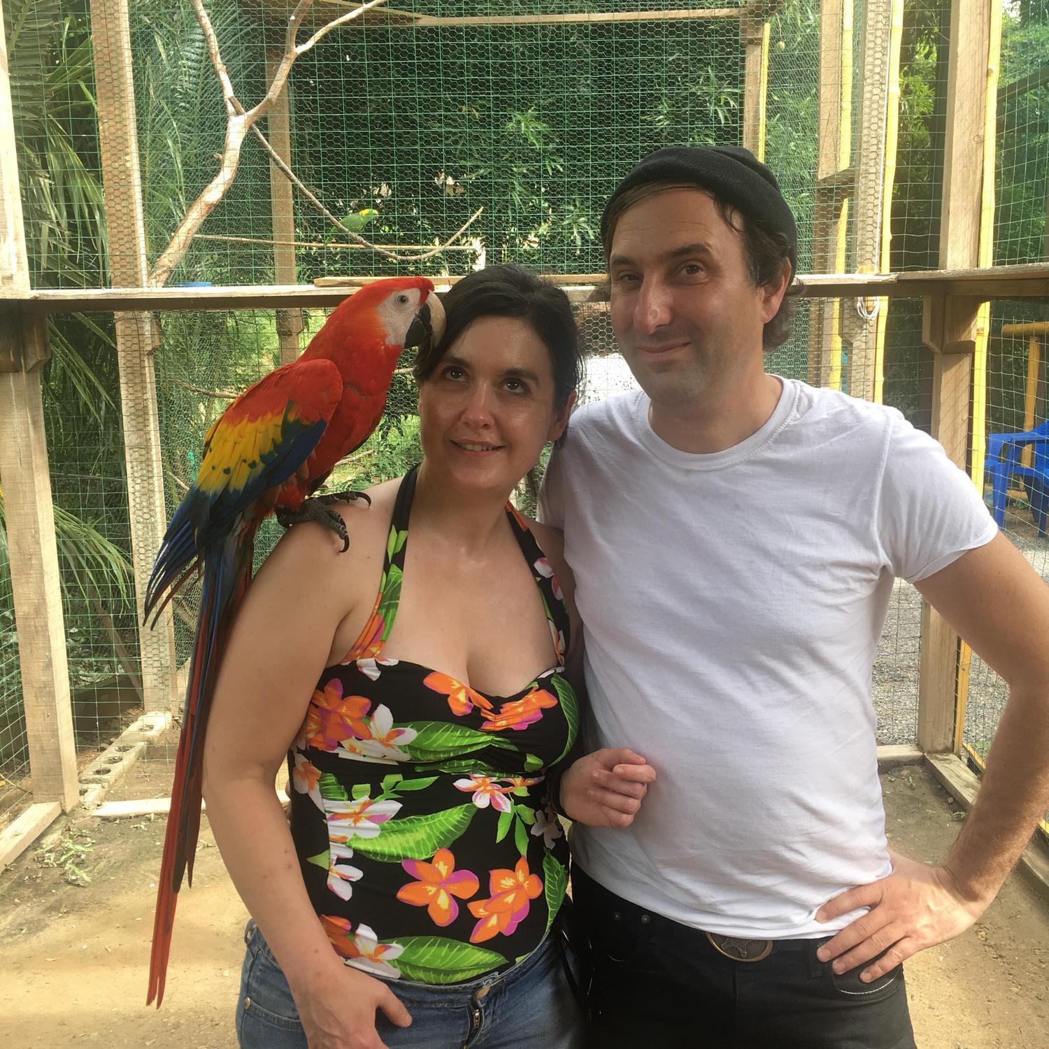 Jamie and Rocky with the parrot.