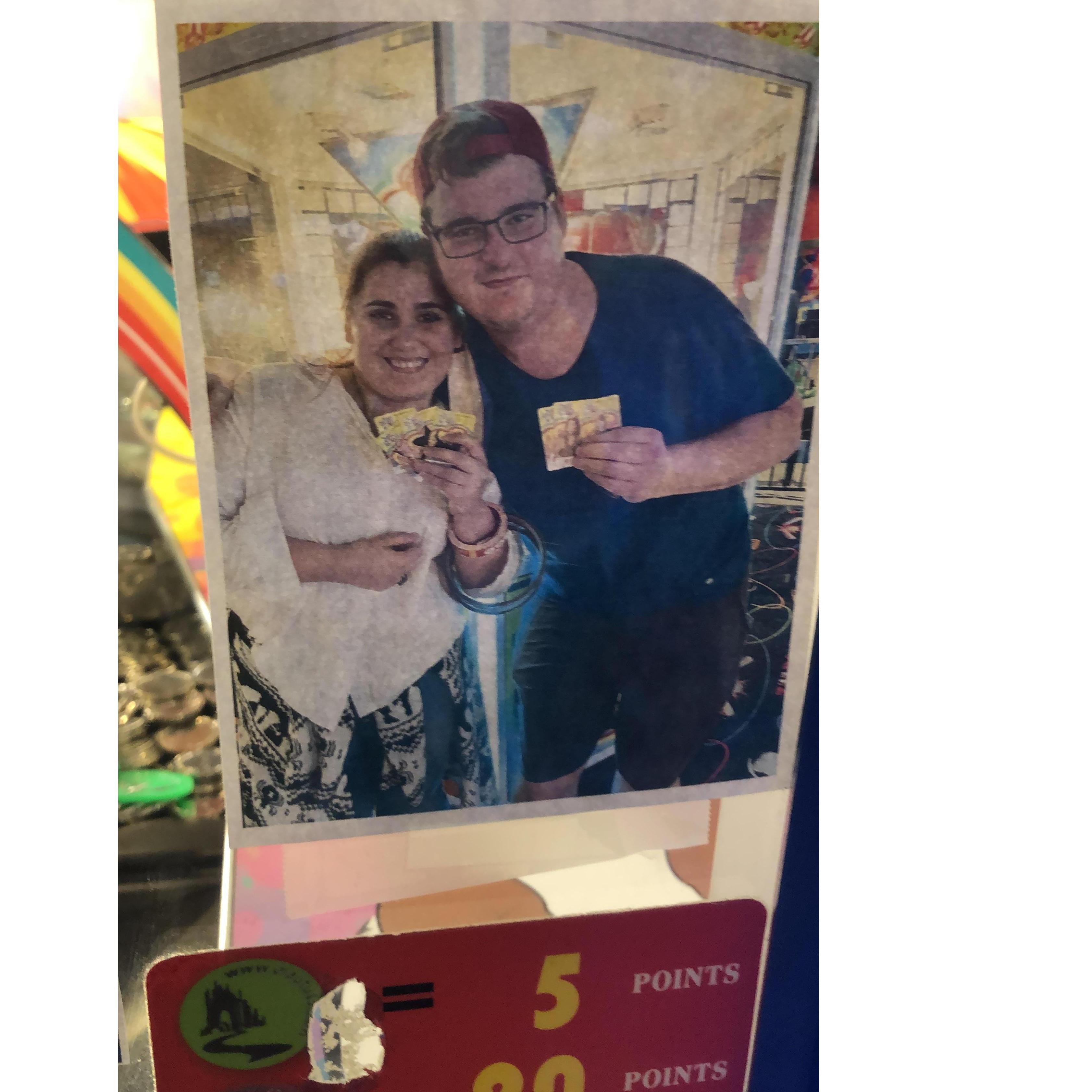 On our year Anniversary  we went to the place where we had our first date and our picture ended up in the wizard of oz machine