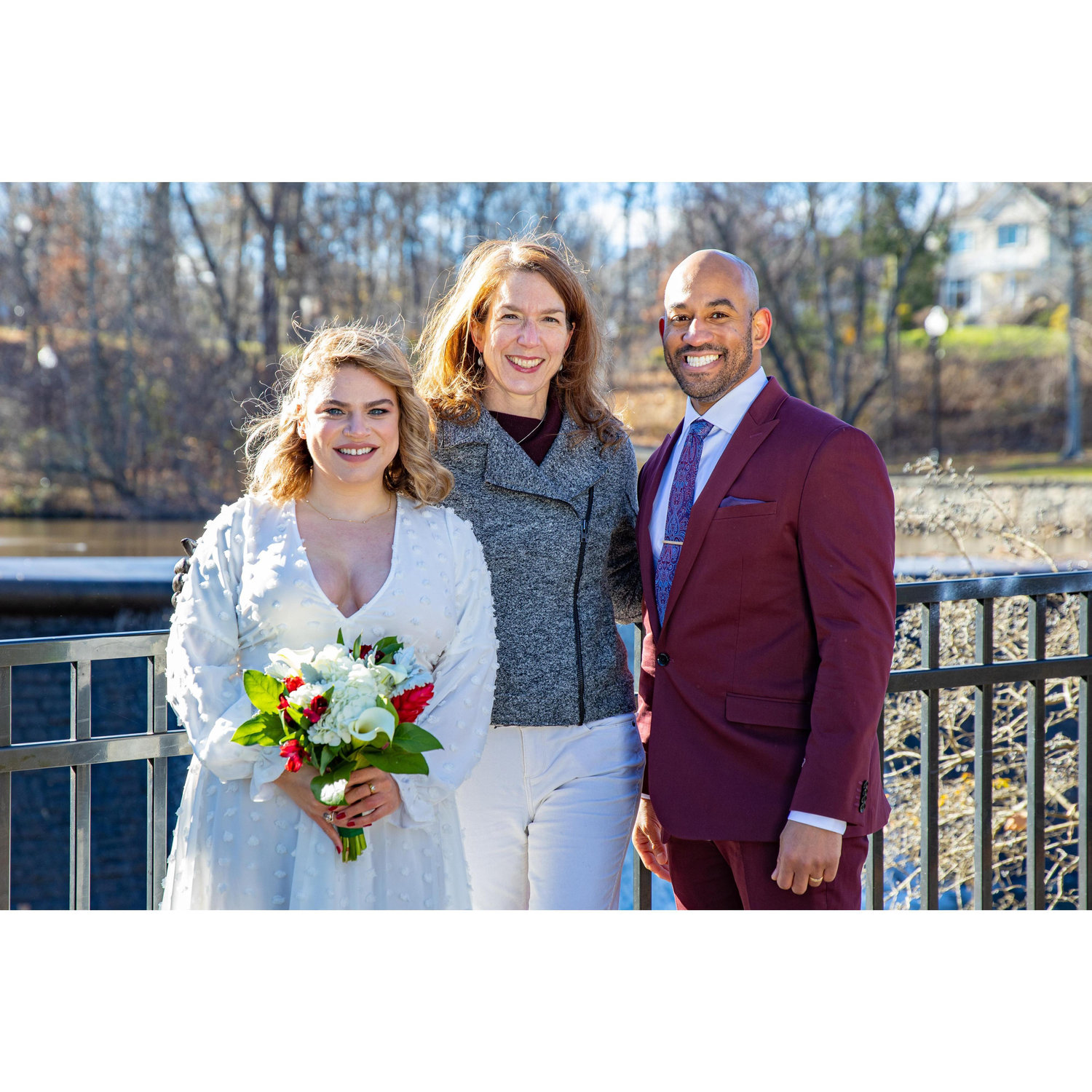 The couple with the amazing officiant, Caroline