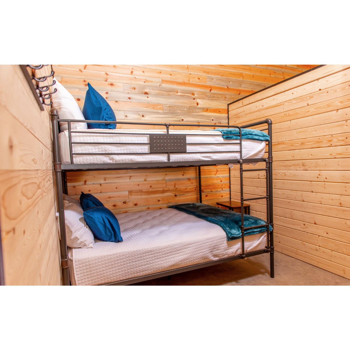 "Poka" "Thunder" and "Bella" all have an identical room setup. Each has a queen bunkbed. Sleeps 4.