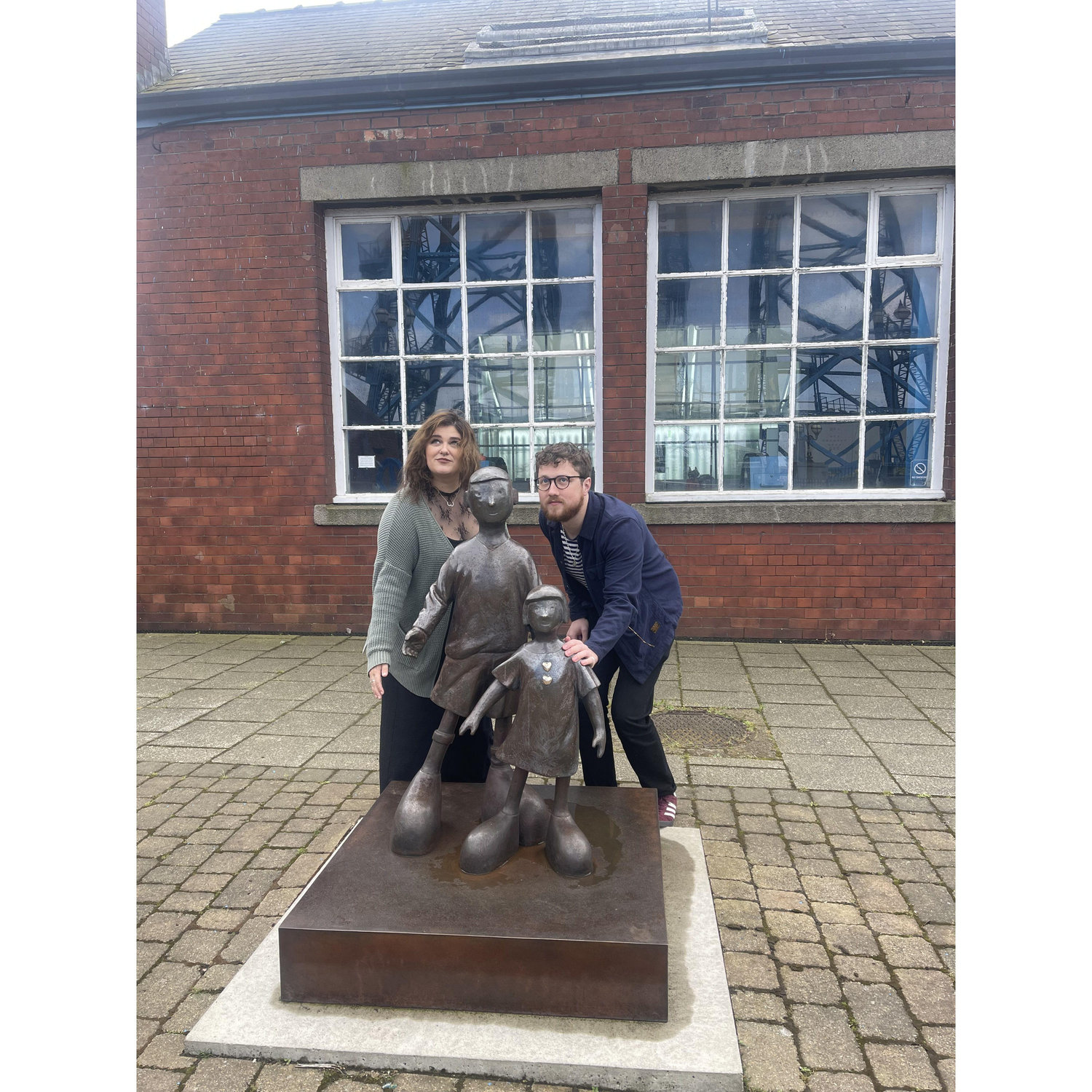 "Waiting for dad"
(That's the name of the statue, Tony does not commute over the Transporter Bridge)