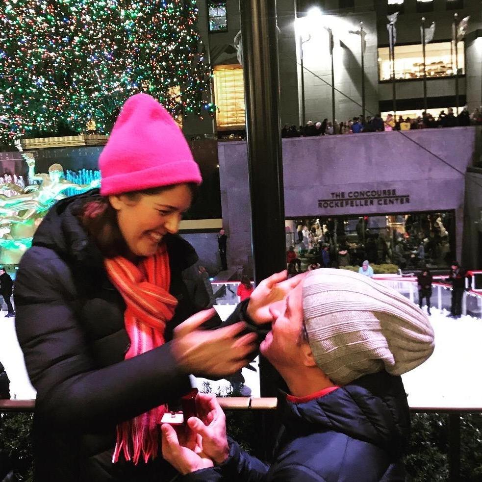 Getting engaged at the Christmas tree 9 years later.
