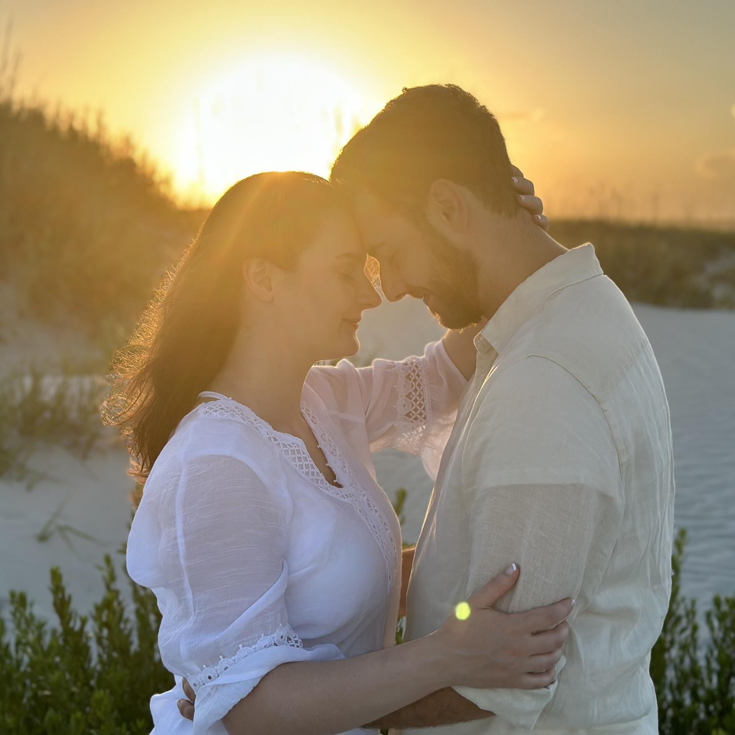 These are pictures from when Ethan proposed on beautiful Sunset Beach, NC...and he said we were just going to take "nice pictures.” We’re so glad Anya’s mom was able to capture the wonderful moment!