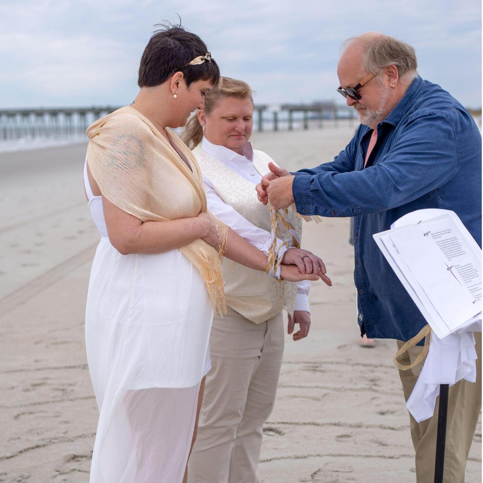 "Tying the knot" in our handfasting ceremony.