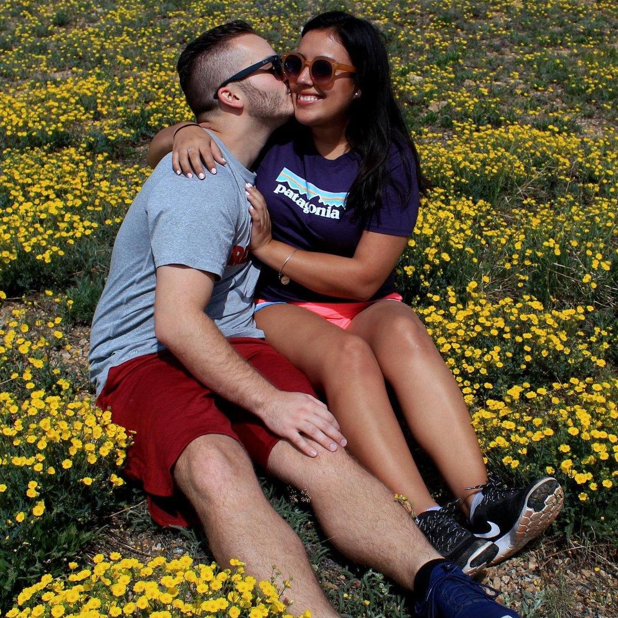 On our way to Yellowstone in a bed of yellow flowers :) 30 minutes before he proposed!