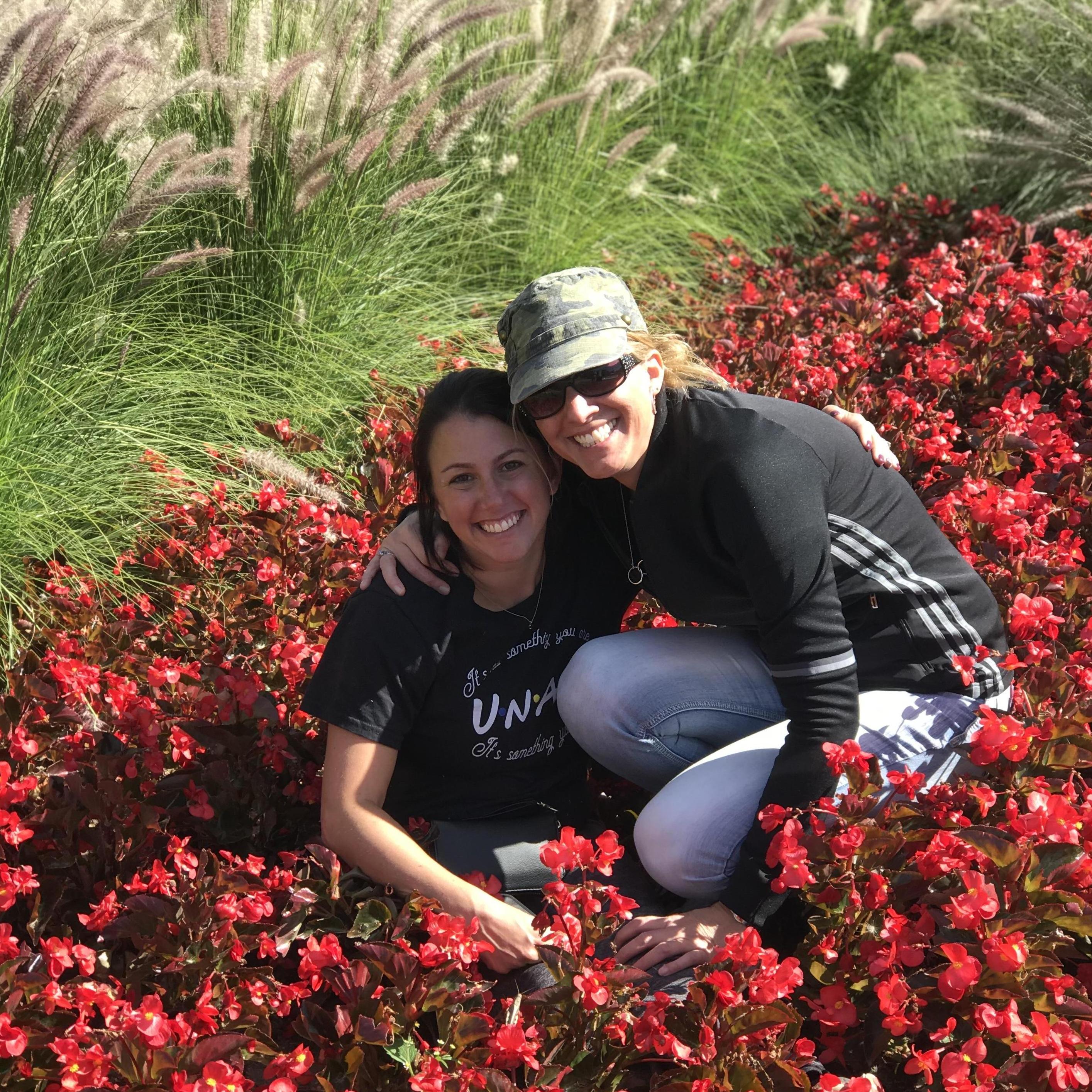 Sheena & Pizzi in Denver exploring the sights (and flower beds)! (photo cred: Emily)