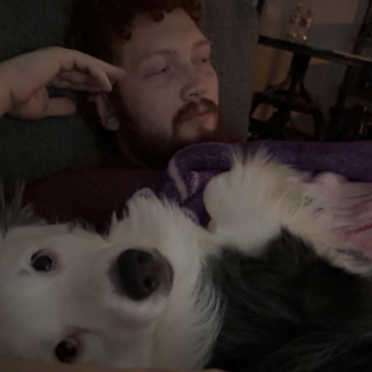 5.21.24 Shawn & Arlo relaxing on the couch.