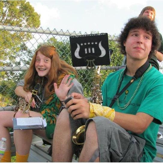 Both of us used to have some great hair. We met in marching band. Both of us love performing and listening to music. One time at band camp...