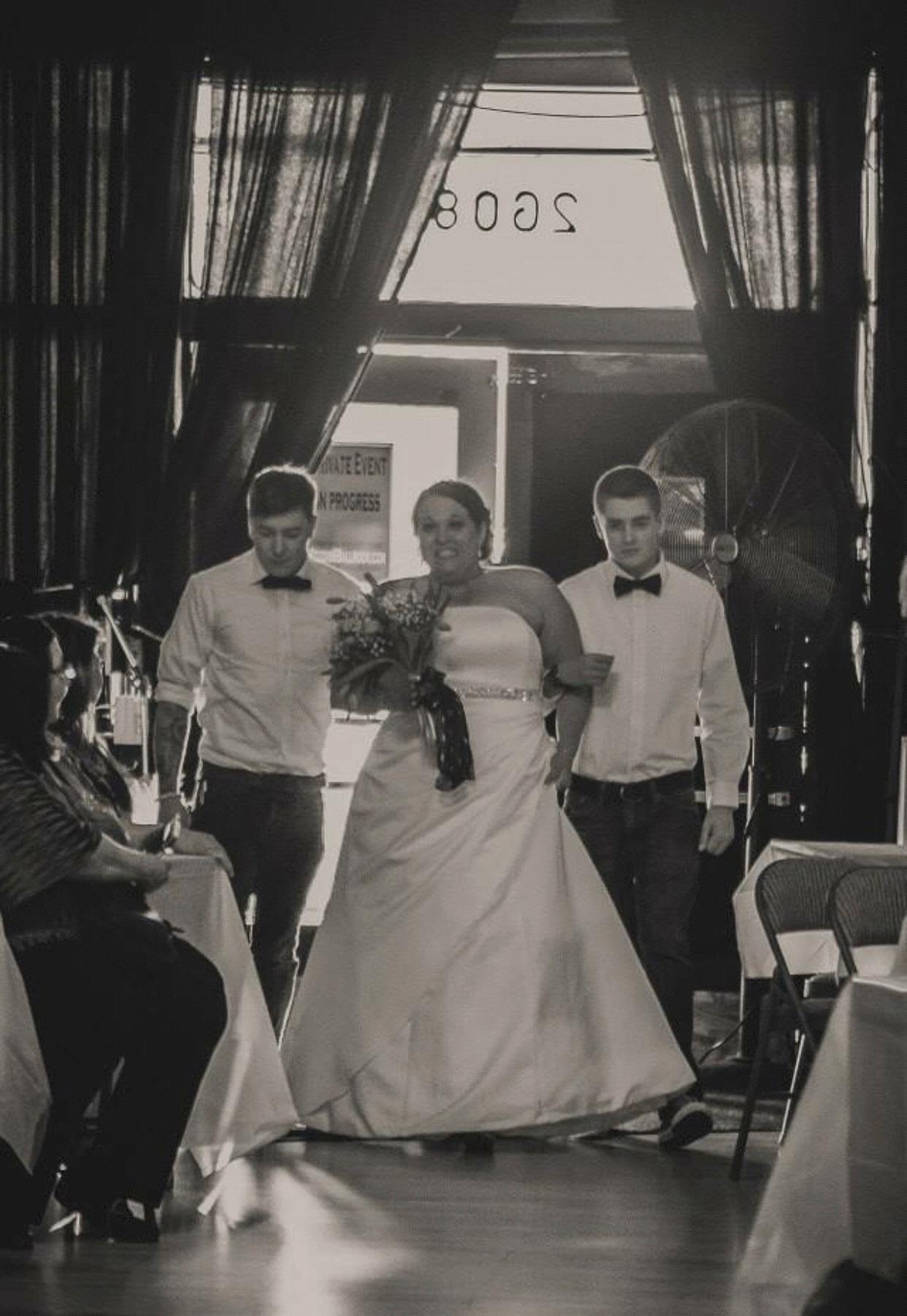 Cody and his brother Austin walking his bad a** aunt Whitney down the aisle