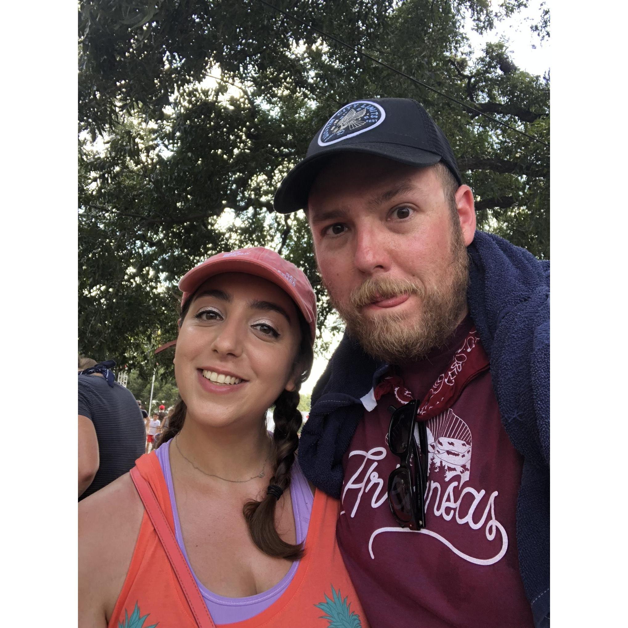 Despite disliking live music, Kimya manages to drag Alex to at least one day of the Austin City Limits Music Festival every year.