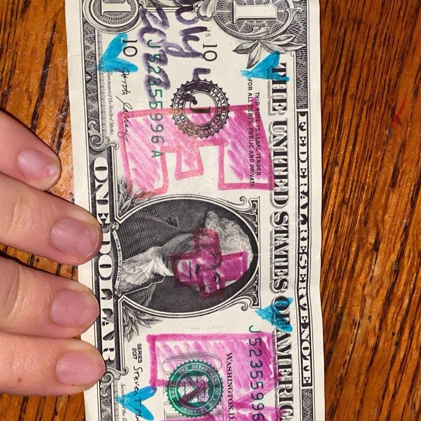 Dollar bill we decorated and hung up in a restaurant in Charleston.
