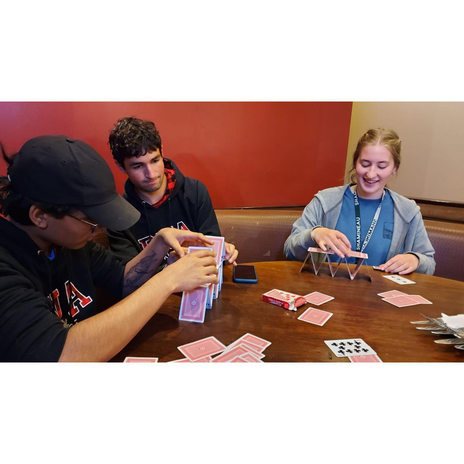 Building card towers while waiting in a restaurant summer 2023 trip to Kenya