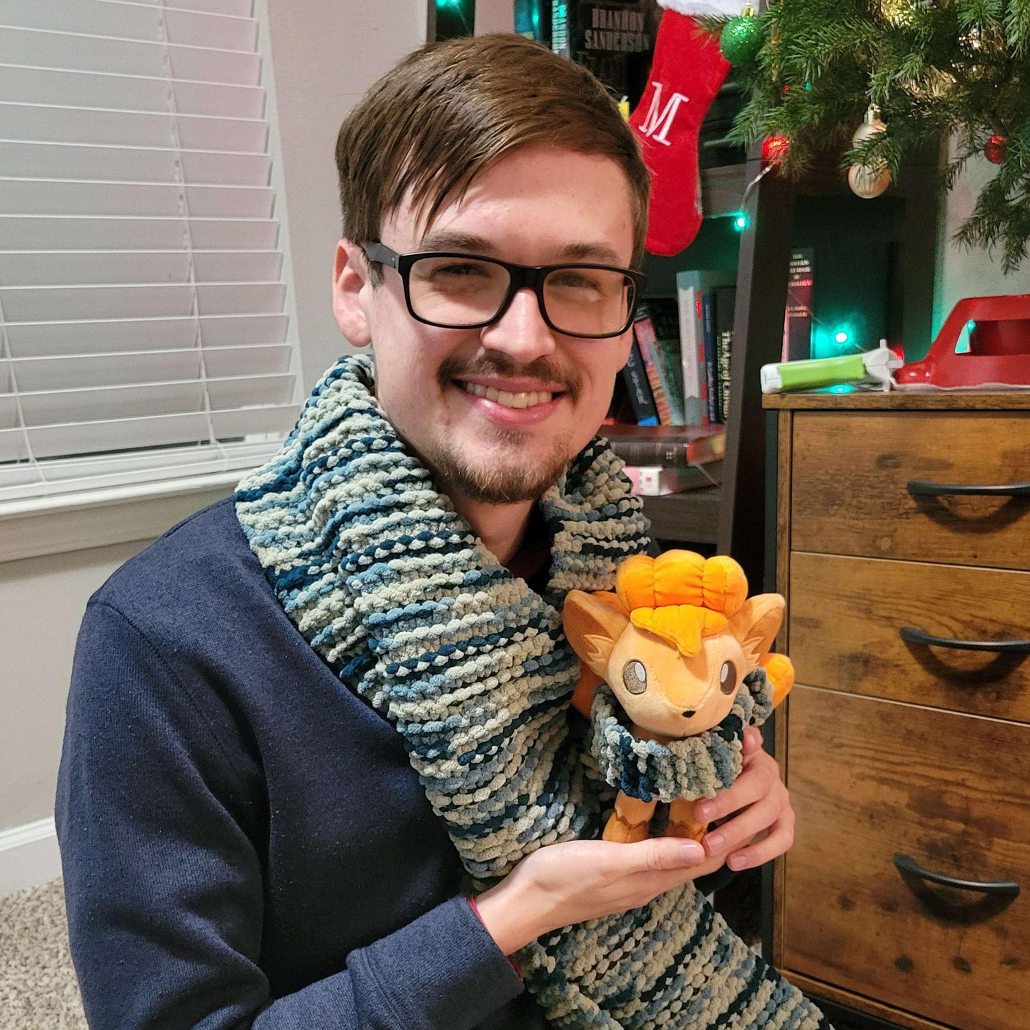 Jackson's first Christmas with Susan and Mabel, we got matching scarves and our favorite pokemon!
