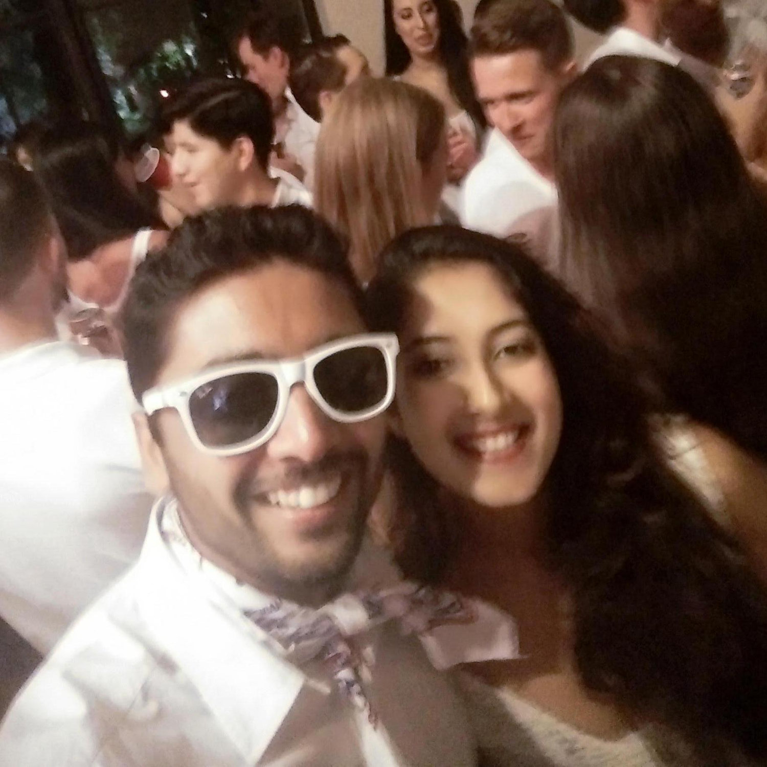 Our first ever picture together. Our memory of the night is as blurry as the picture