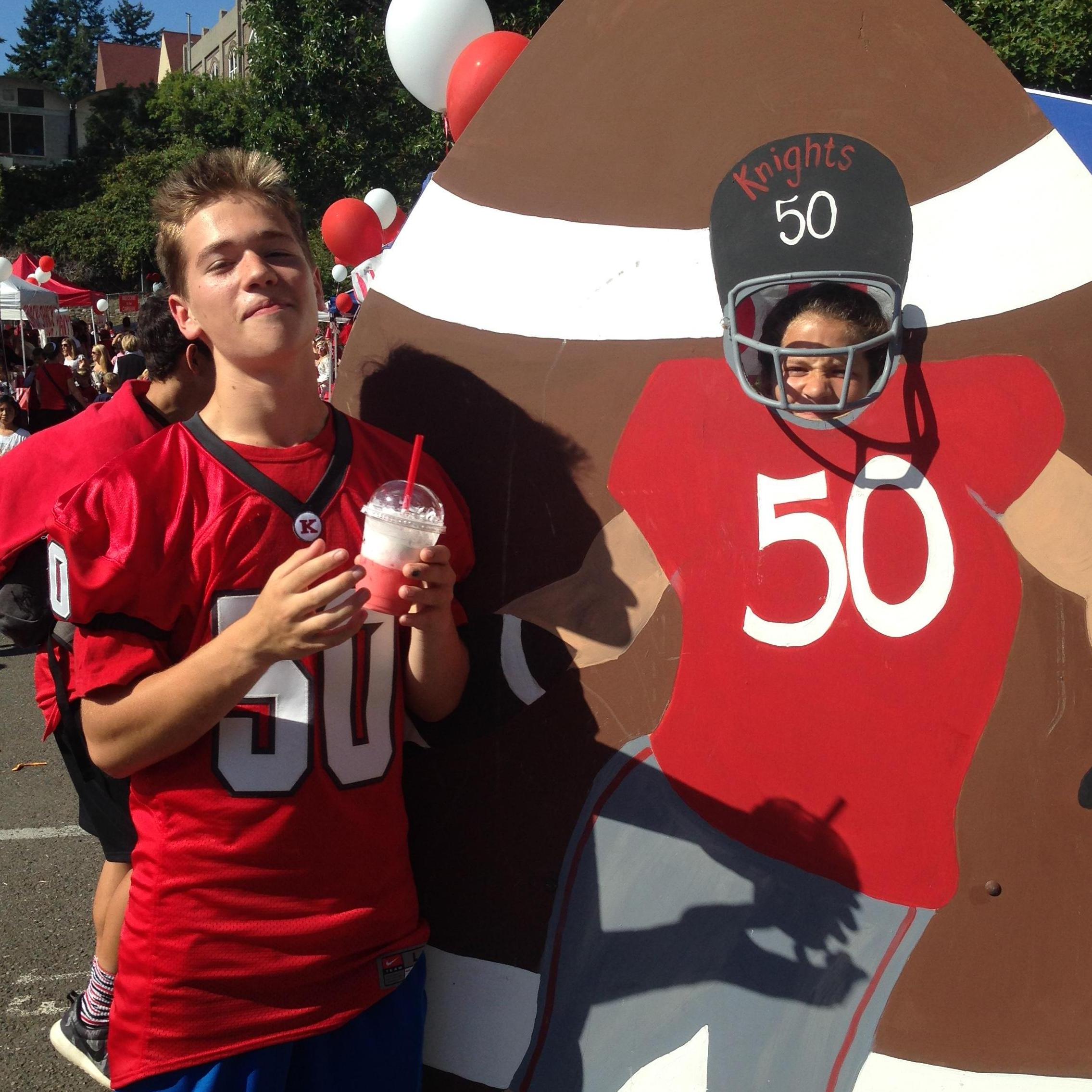 KHS Carnival, 2015. We thought it was funny that John had the same number as the cutout, and had to take a picture!