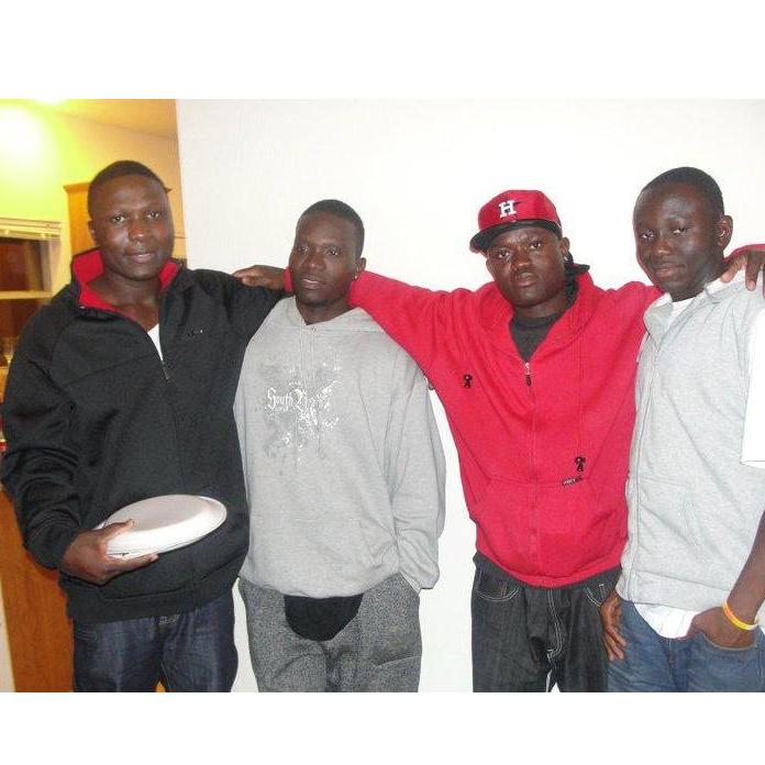 Roland, Joe, Moses, and Bill celebrating Christmas. Roland ALWAYS has a to go plate. LOL