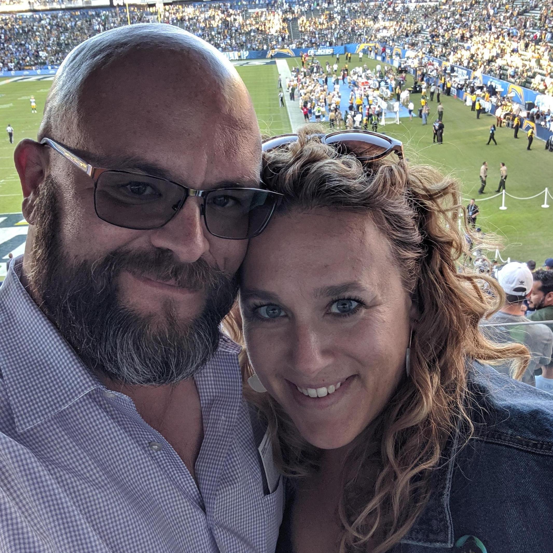 Ed and Meg at a Los Angeles Chargers football game (before they moved to their new stadium)