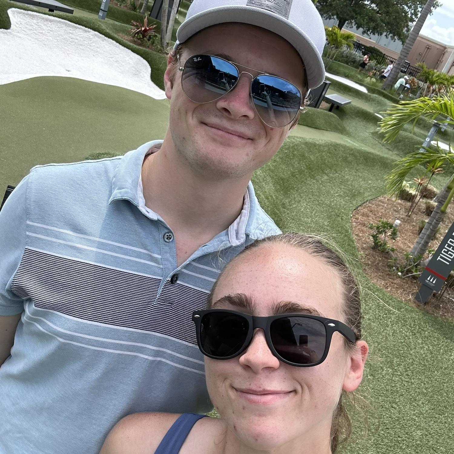 Kristen and Sean mini golfing at Pop Stroke in Orlando.