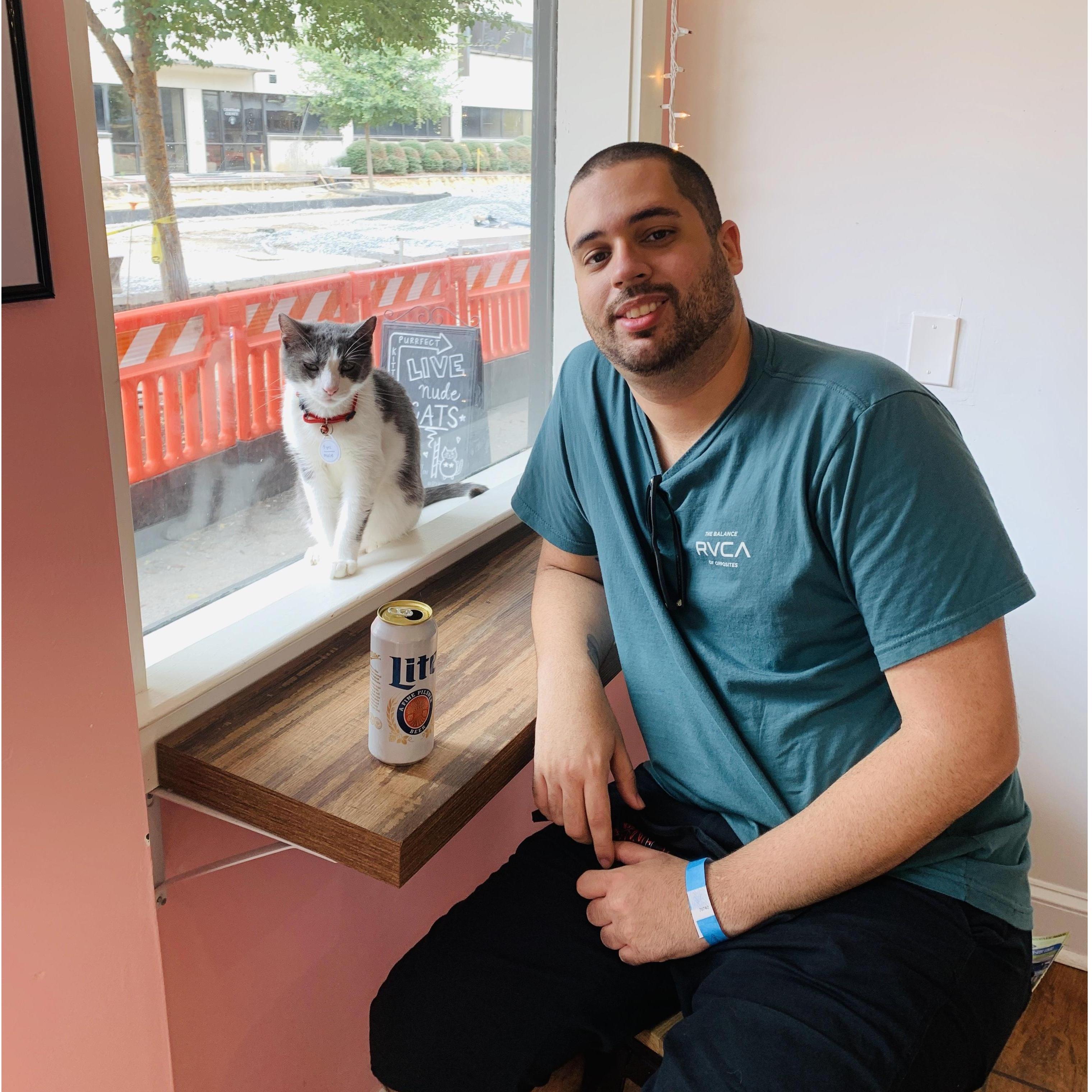 Having fun at Pounce Cat Cafe in Savannah.