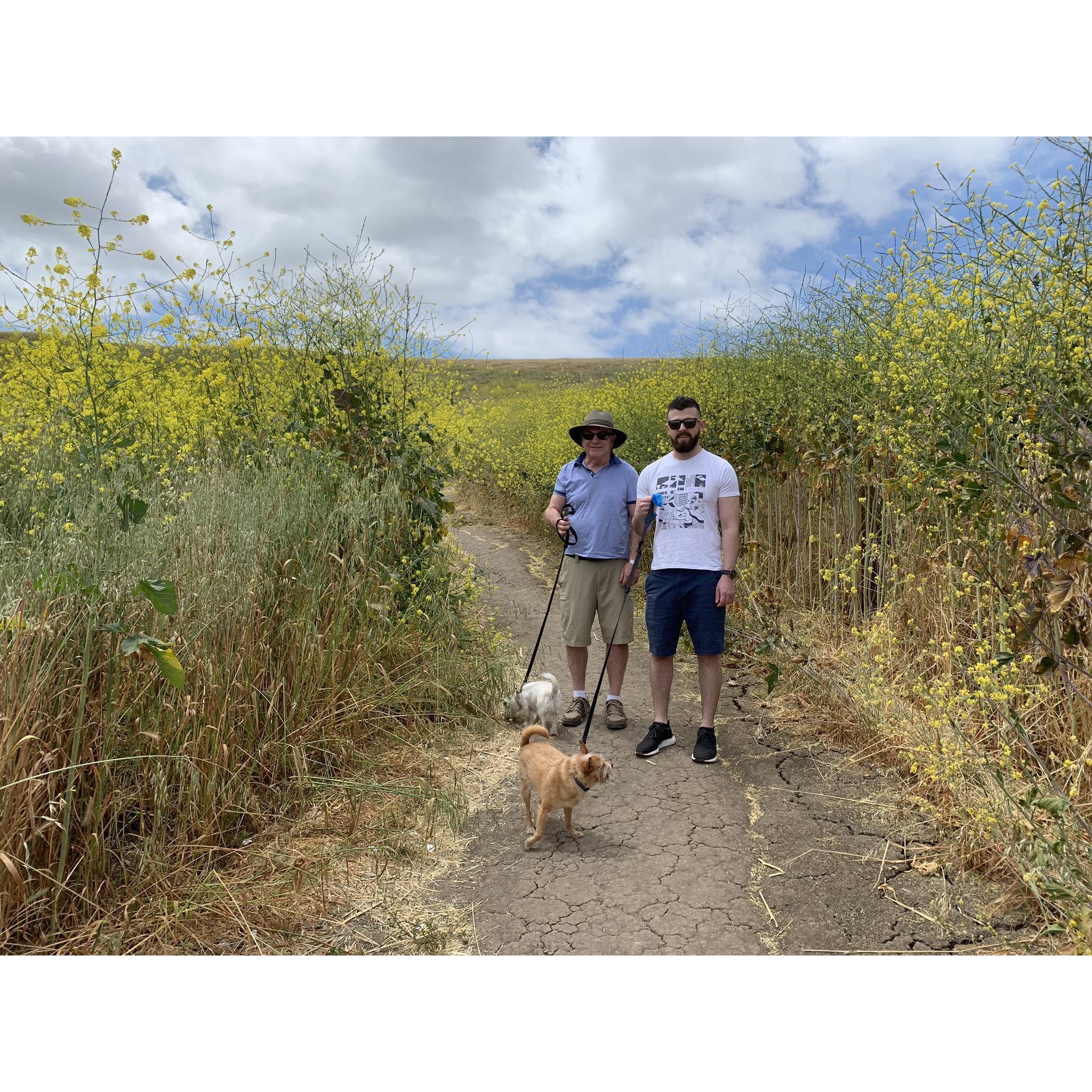 Two macho men with tiny dogs