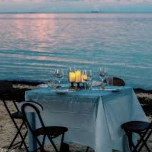 Candlelit dinner for two on the beach