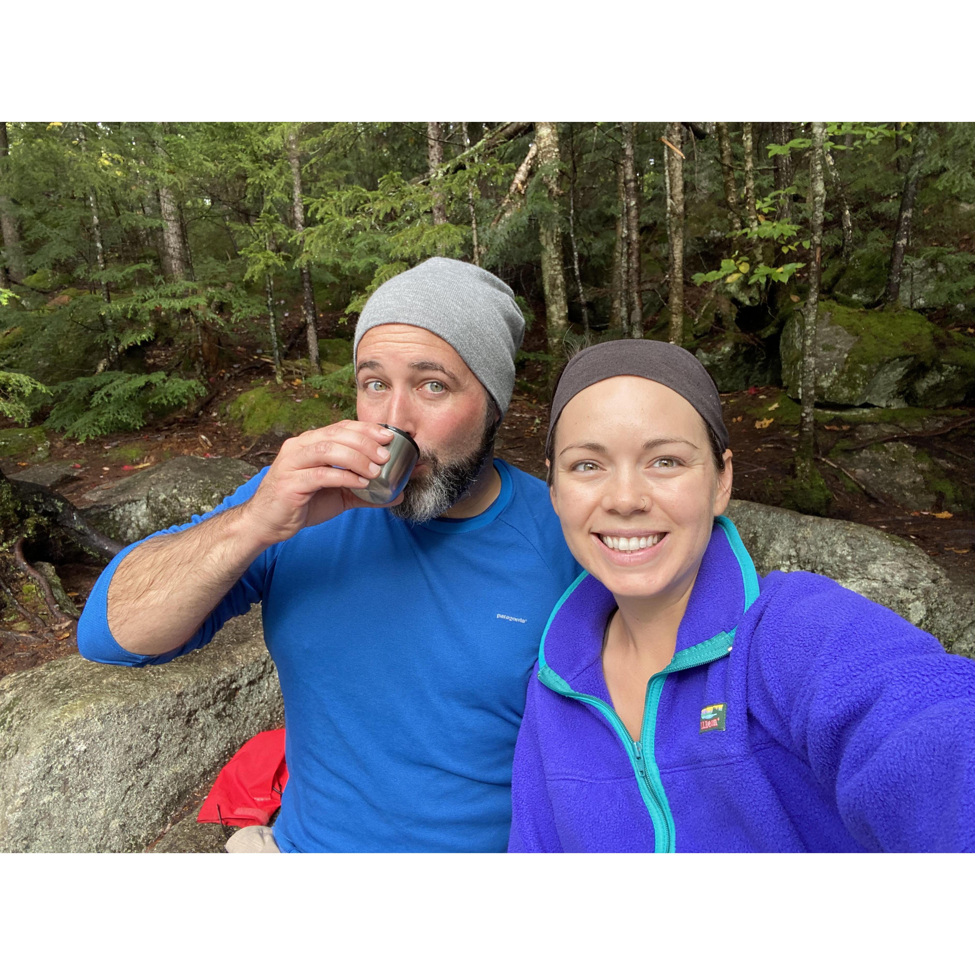 At a waterfall in New Hampshire, post-hike.