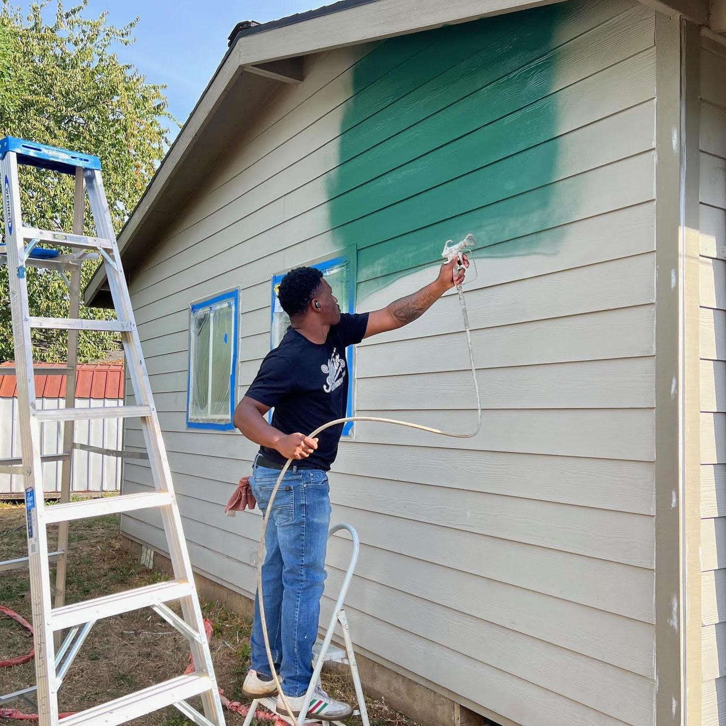 Mari did the prep and taping, Xavier expertly sprayed the house and we were done by lunch time! :)