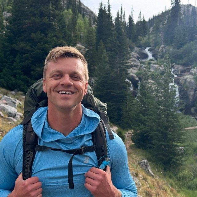 Gereth asked for his photo to be taken on our backpacking trip. He proposed just beneath the waterfall in the background!