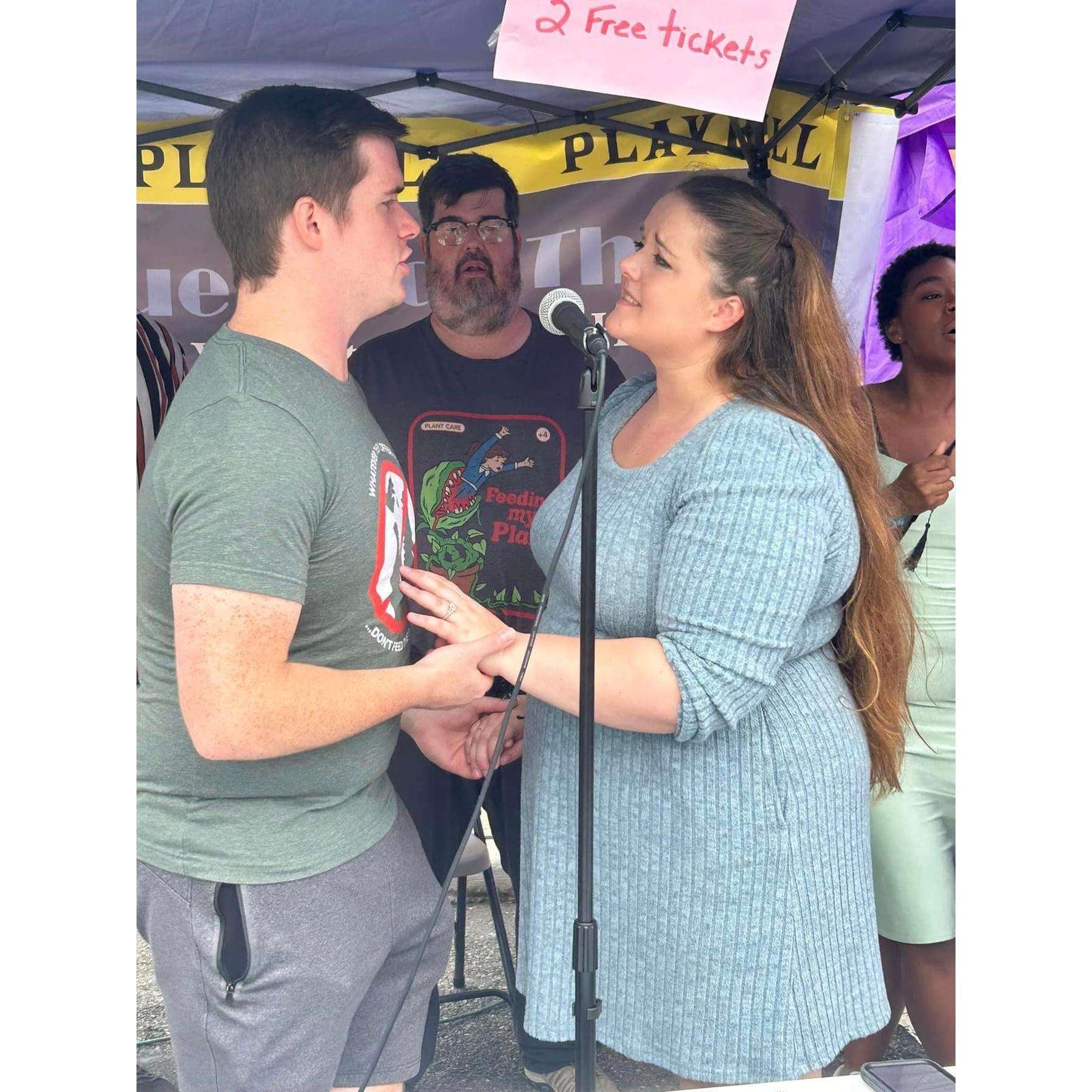 Nick and Aimee singing together at the Woodstown Fall Festival as an advertisement for Little Shop of Horrors (2024).