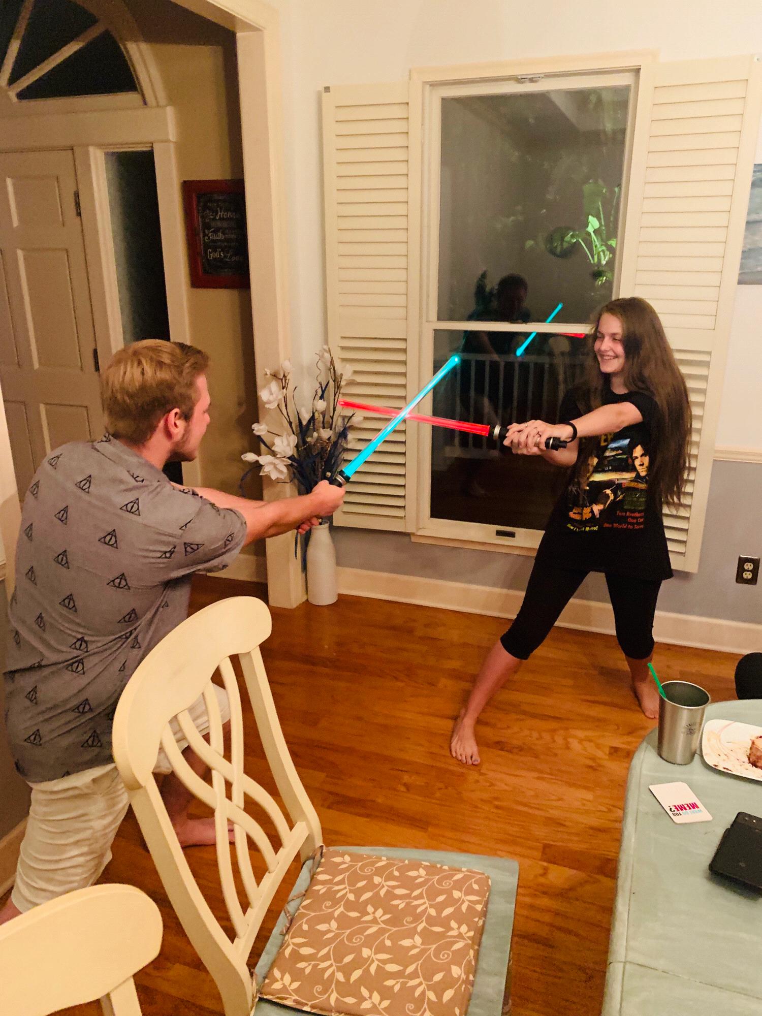 Nerding out together! Our first lightsaber battle!