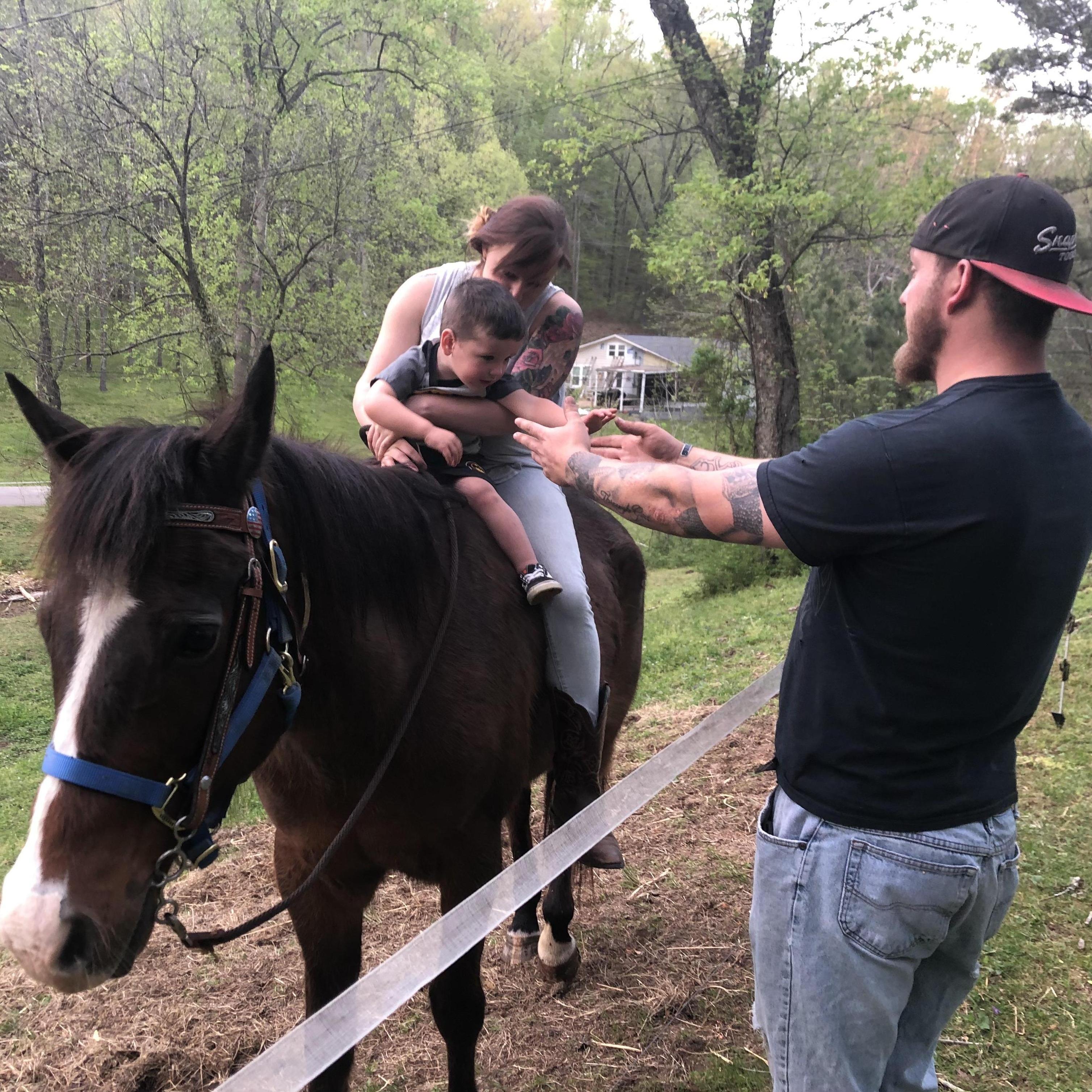 Teaching cousin Jameson how to ride a horse